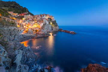 Manarola town on the coast of Ligurian Sea at dusk, Italy © Patryk Kosmider