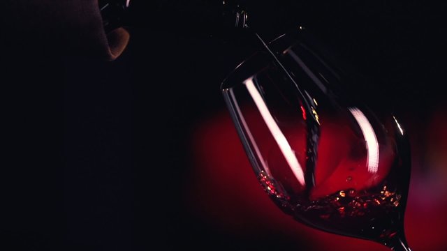 Red Wine Pouring into Glass