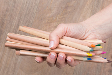 Used pencils in hand