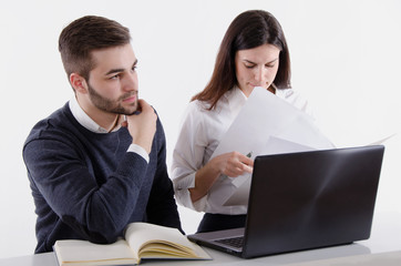 Business Couple With Laptop and Papers