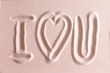 I Love You drawn in golden beach sand