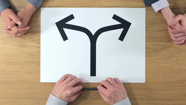 Businessman thinking and choosing between two candidates with tw
