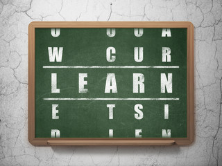 Education concept: word Learn in solving Crossword Puzzle