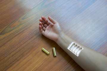 Insert the battery in the arm, Woman arm,Need more power of life - obrazy, fototapety, plakaty
