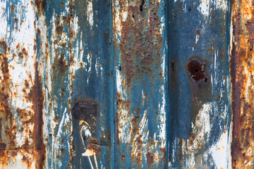 red rusted on the metal wall with planks. background and Texture