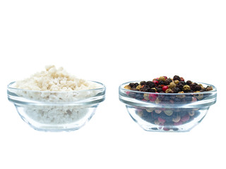Sea salt and pepper in glass bowl isolated on white