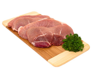 Fresh porc cuts on plank global view