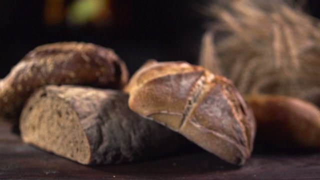 Various Bread and Sheaf of Wheat Ears. Slow Motion 240 fps