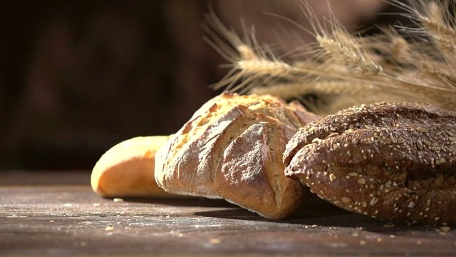 Bakery Bread on a Wooden Table. Slow Motion 240 fps