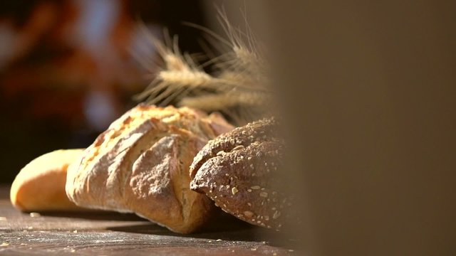 Bakery Bread on a Wooden Table. Slow Motion 240 fps