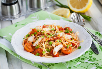 Fresh delicious pasta with fish and tomato sauce