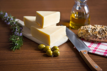 Arrangement of olive oil and cheese