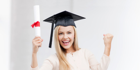 student in graduation cap with certificate