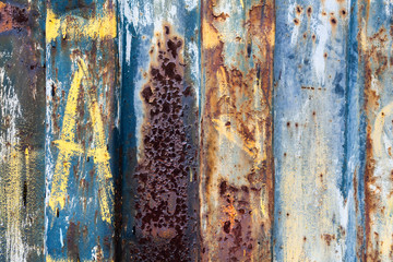 red rusted on the metal wall with planks. background, Texture