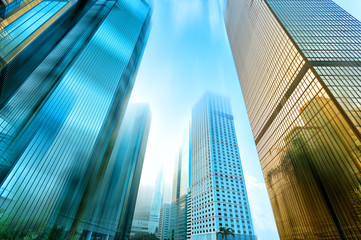 Fototapeta na wymiar low angle view of skyscrapers in blurred motion.