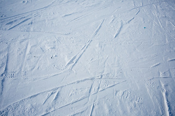 Traces of skis and shoe on the snow