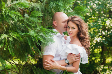 Sensual portrait of a beautiful couple are kissing and hugging