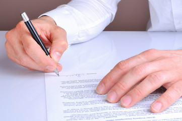 Client signing the mortgage loan agreement rear view