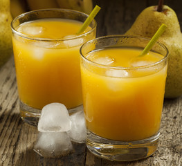 multifruit citrus juice from oranges, lemons, bananas in a glass