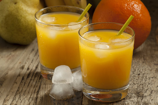 multifruit citrus juice from oranges, lemons, bananas in a glass