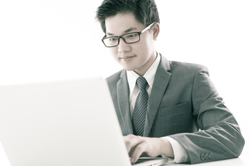 Handsome businessman working with laptop
