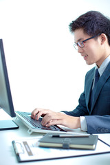 Handsome businessman working with laptop