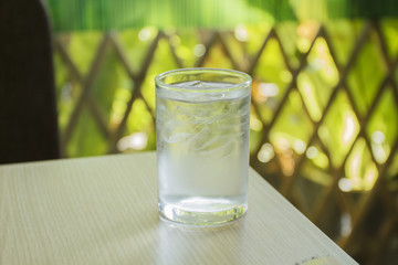 glass of water on wood table