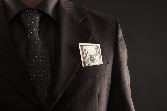 Businessman with one hundred dollars