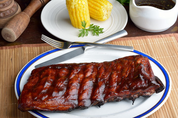 Pork ribs back with corn on the cob