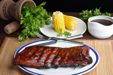 Pork ribs back with corn on the cob