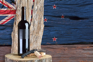 bottle of wine with New Zealand flag in the background
