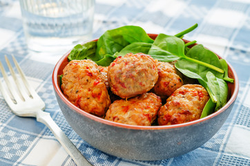 baked meatballs with pepper and spinach