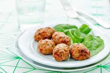 baked meatballs with pepper and spinach