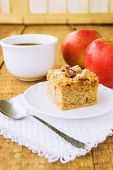 Homemade apple pie and tea on wooden table