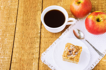 Homemade apple pie and coffee on wooden table