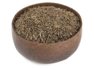 dried cumin in a wooden bowl