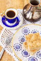 Homemade apple pie and coffee on wooden table