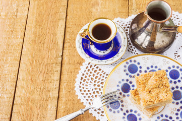 Homemade apple pie and coffee on wooden table