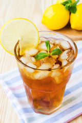 Glasse of ice tea with lemons and mint