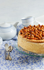 Cake with mousse, caramelized apples, hazelnut in caramel