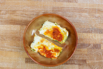 italian lasagna with tomato inside ceramic bowl