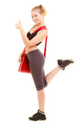 Sport. Fitness sporty girl with gym bag showing thumb up