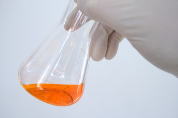 Erlenmeyer Flask filled with an orange liquid