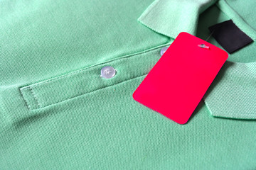 Green Polo T-shirt and blank label.