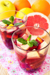 Homemade delicious red sangria with limes oranges, apples and gr