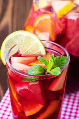 Refreshing summer drink with lots of different fruits