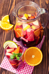 Homemade delicious red sangria with limes oranges, apples and gr