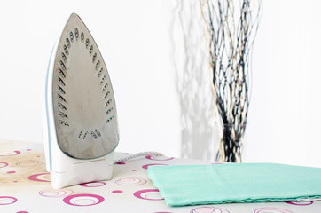 Iron on an ironing board