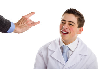 boy doctor smiling in front of horns sign