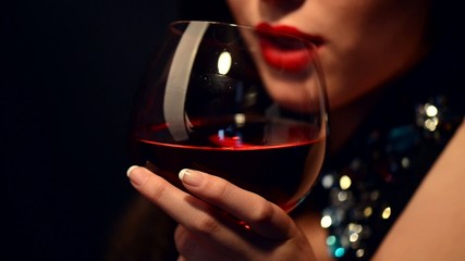Beautiful young woman drinking red wine - Powered by Adobe
